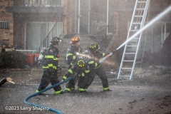 Firefighters operate a 2 1/2 inch one ofrom Sector C. Larry Shapiro photo
