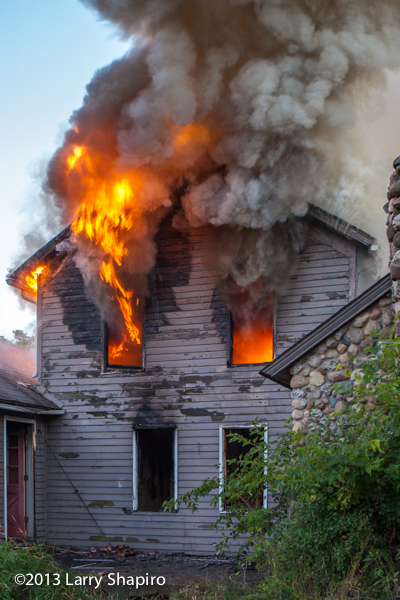photo of abandoned house on fire