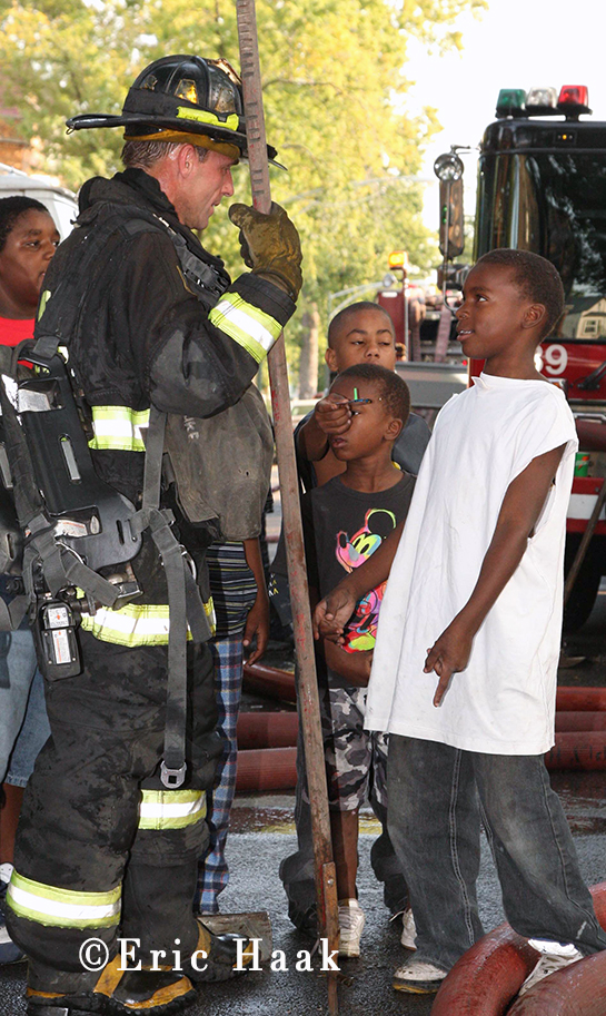 Chicago fireman talks to kids after fighting fire