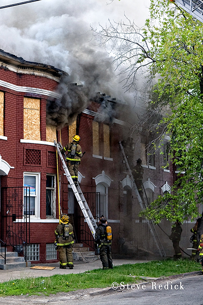 Detroit firemen fighting vacant building fire