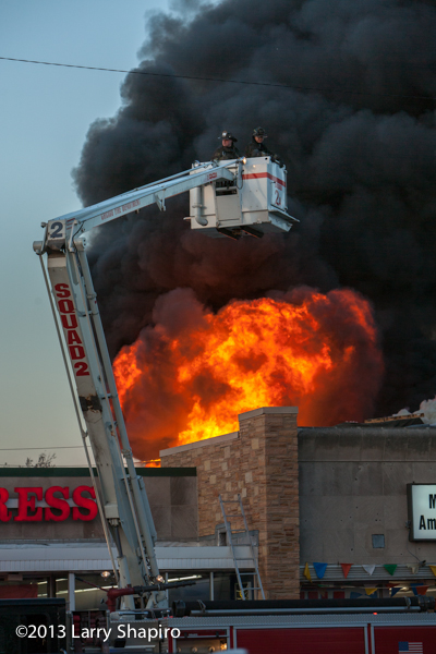 massive 4-11 alarm fire destroys stores on Chicago's north side