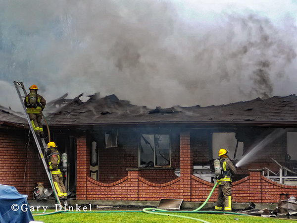 Canadian firemen battle house fire
