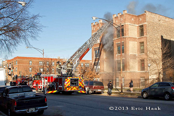 Chicago firemen battle a winter fire in a four-story apartment building 12-7-13