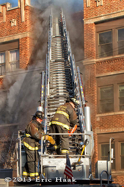 Chicago firemen battle a winter fire in a four-story apartment building 12-7-13.