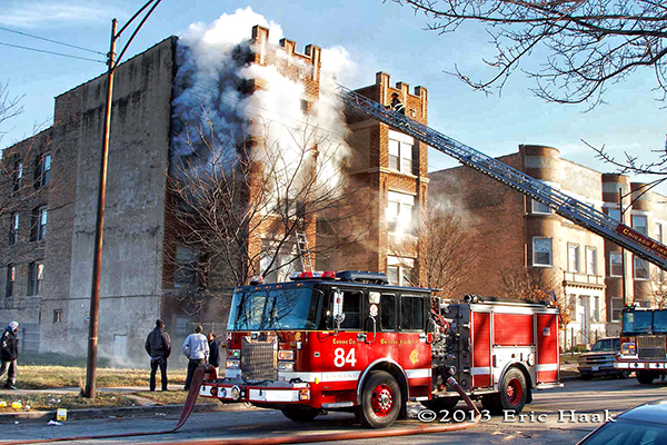 Chicago firemen battle a winter fire in a four-story apartment building 12-7-13