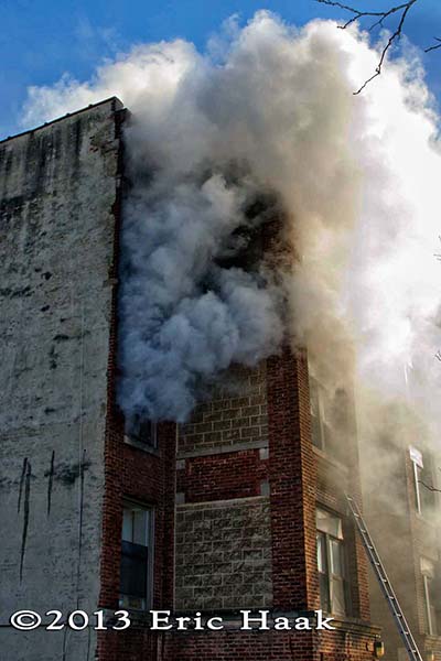 Chicago firemen battle a winter fire in a four-story apartment building 12-7-13. Eric Haak photo