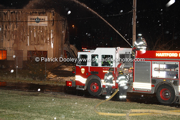 Hartford firemen battle commercial fire at night