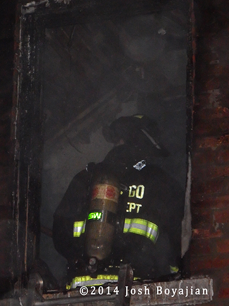fireman inside burning building