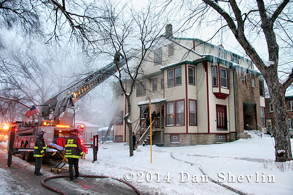Chicago firemen fight winter house fire 