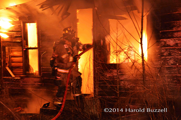 firemen battles fully engulfed house fire