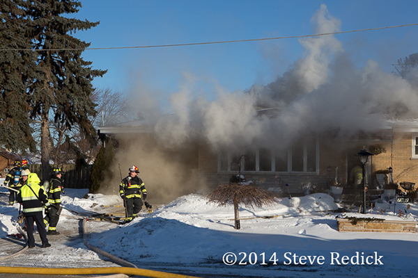 heavy smoke pushes fro house fire