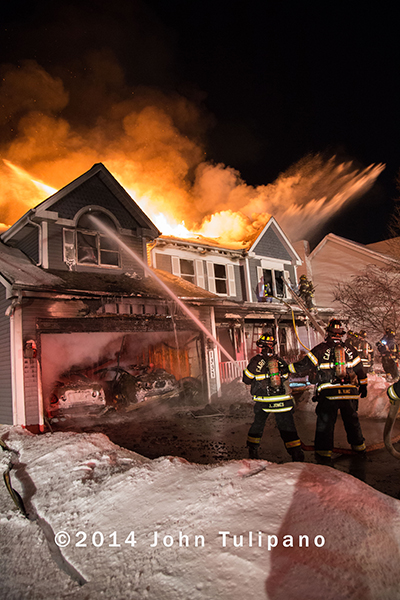 fire engulfs a suburban house
