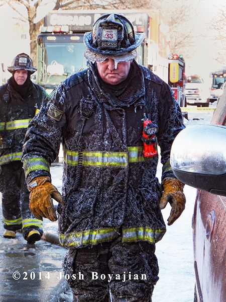 fireman covered with ice at fire scene