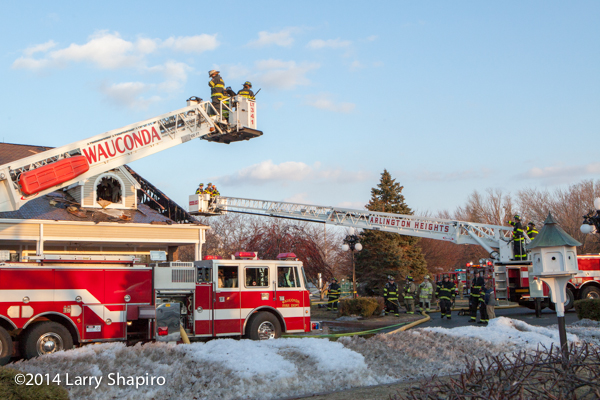Pierce tower ladders at fire scene