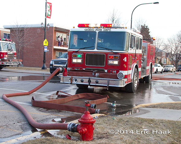 Seagrave fire engine hooked to hydrant