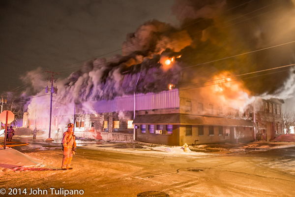 huge night time industrial fire in the winter
