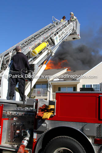 mid-mount tower ladder wt fire scene