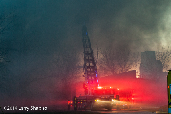 Pierce tower ladder at smokey fire scene