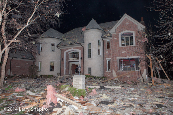house heavily damaged by explosion