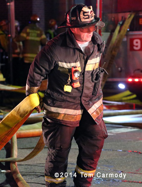Boston fireman at night fire scene