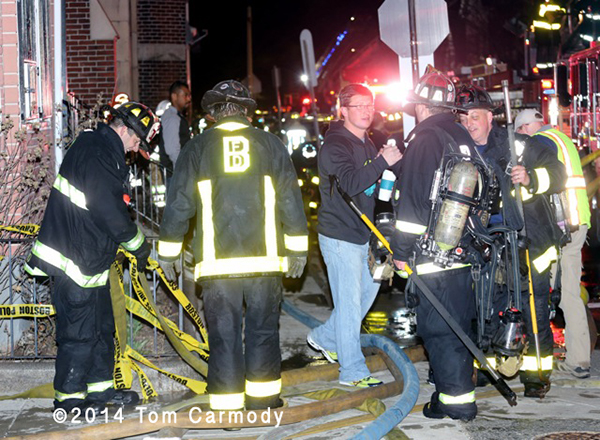 Boston firemen at night fire scene