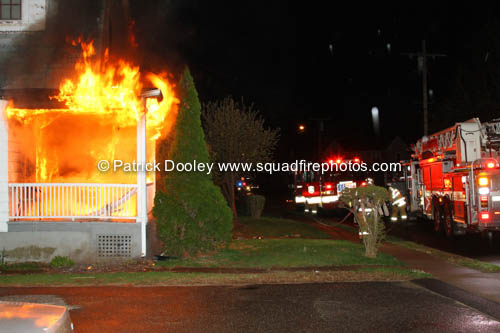 front of house fully engulfed when firemen arrive at night