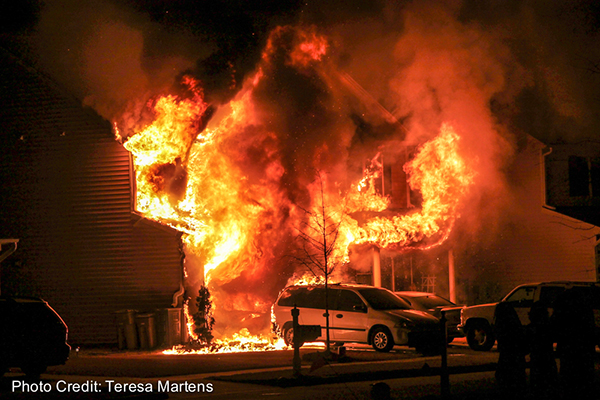 house fully engulfed in fire at night