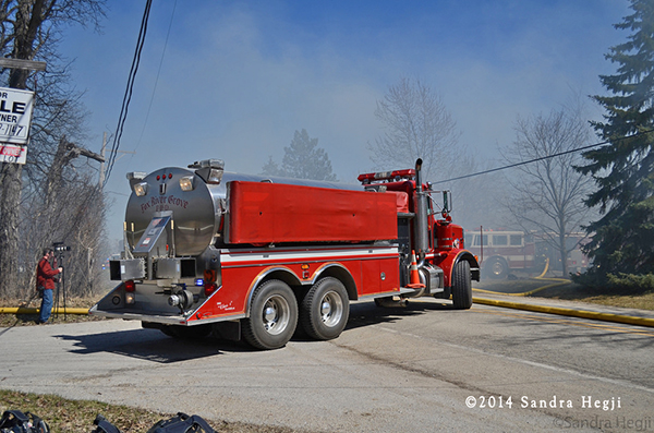 fire department water tender at fire scene