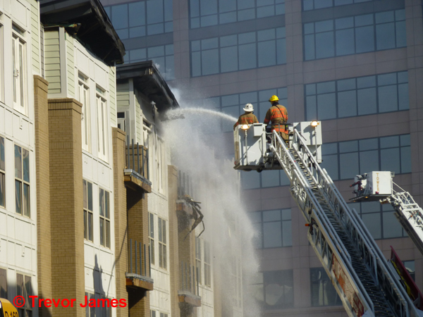 tower ladder working after apartment fire