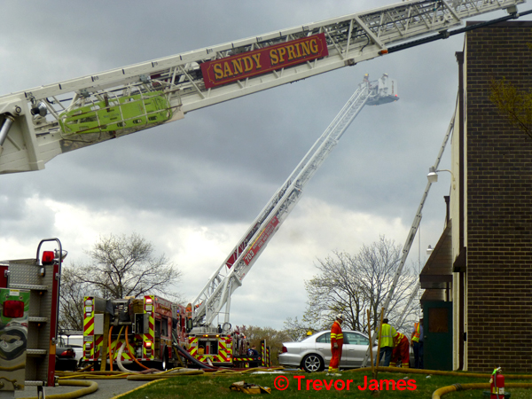 two tower ladders work at fire scene