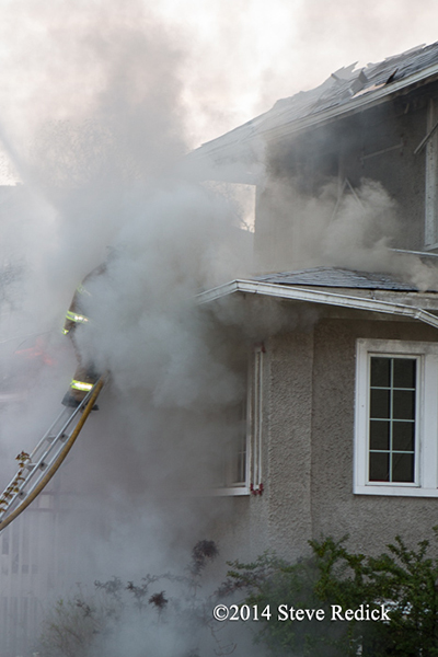 firemen engulfed in smoke at house fire