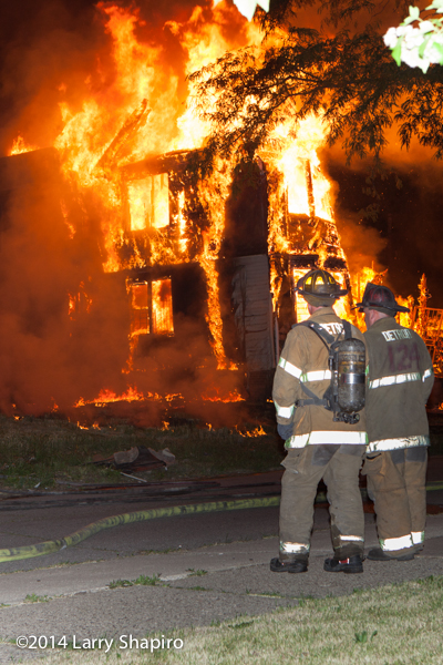 Detroit firemen with fully-engulfed dwelling