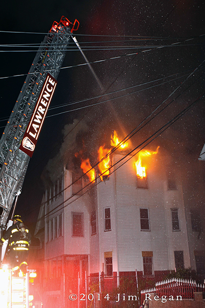 flames from Lawrence triple-decker