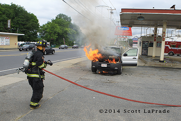 firefighter with car fire
