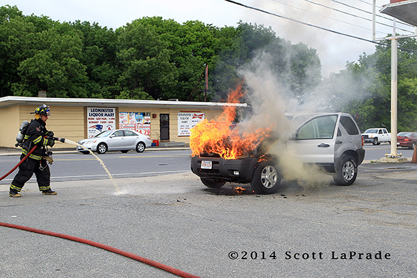 fireman with SUV on fire