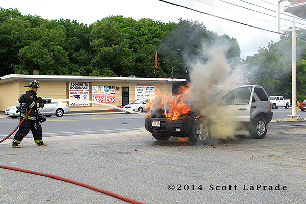 fireman with SUV on fire