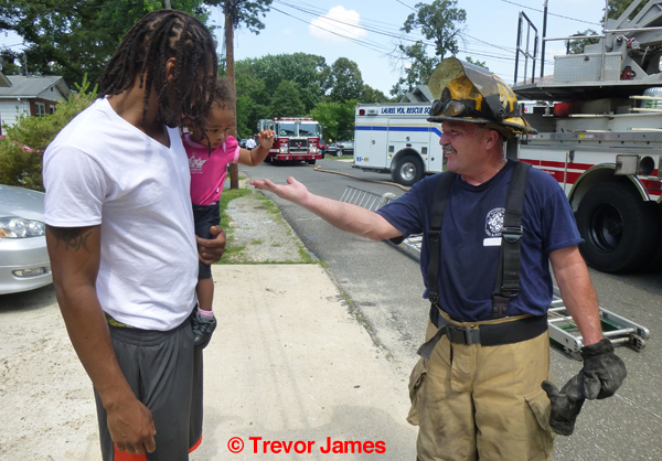 fireman talks with resident