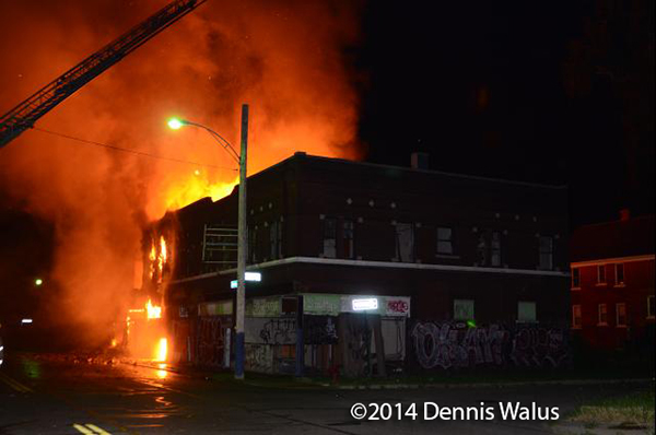 vacant commercial building in Detroit fully involved in fire
