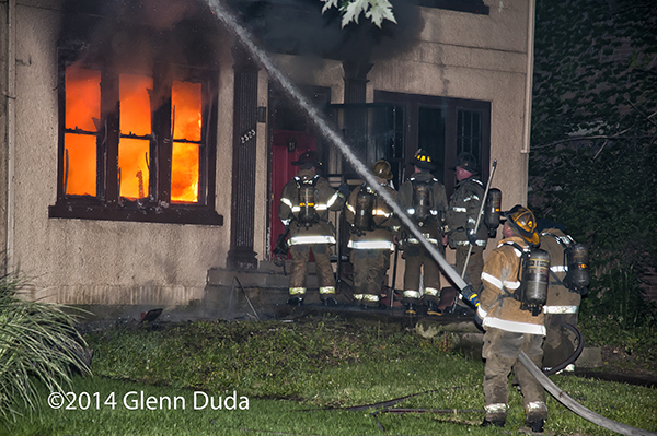 Detroit firemen battling a house fire