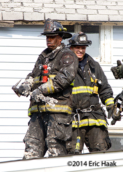 firemen after overhauling fire scene