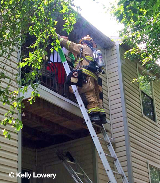 firemen rescue occupant from balcony
