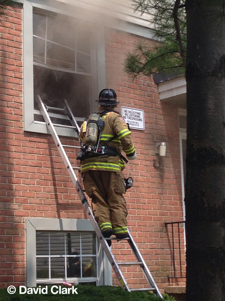 fireman on ladder vents window