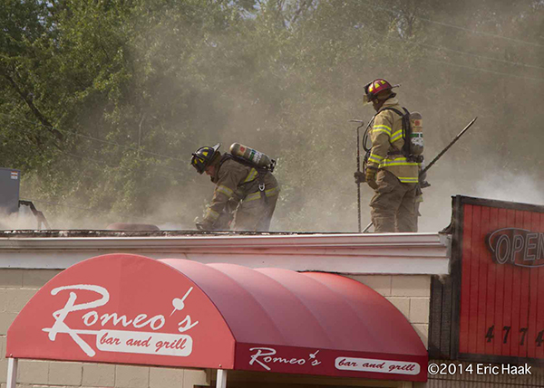 firemen venting flat roof