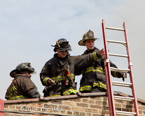 firemen on building roof