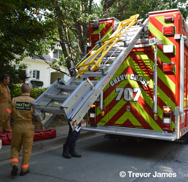 firemen remove gear from squad unit
