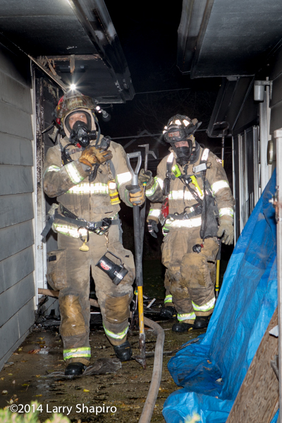 firefighters exiting a house fire