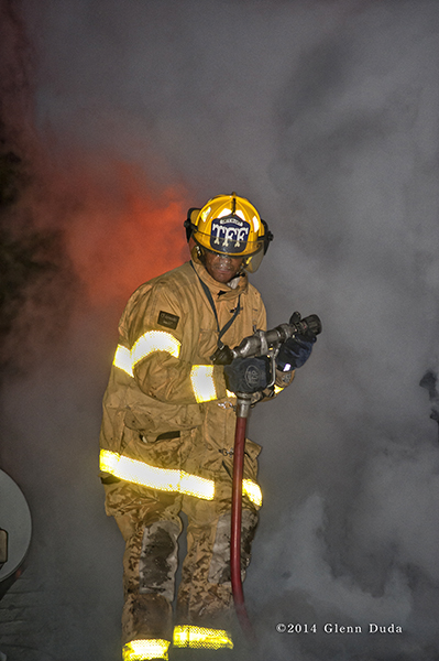 Detroit firefighter at night fire scene