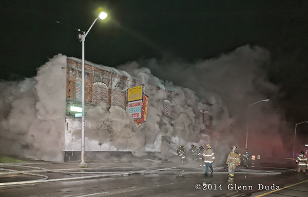 heavy smoke from commercial building at night