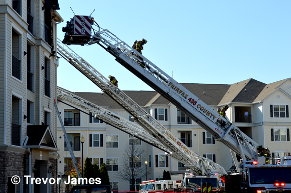 multiple aerial ladders deployed at fire scene