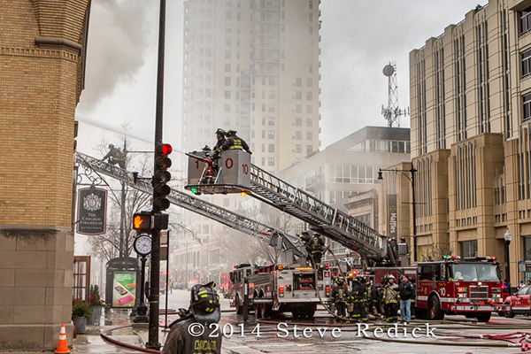 firemen battle fire with heavy smoke